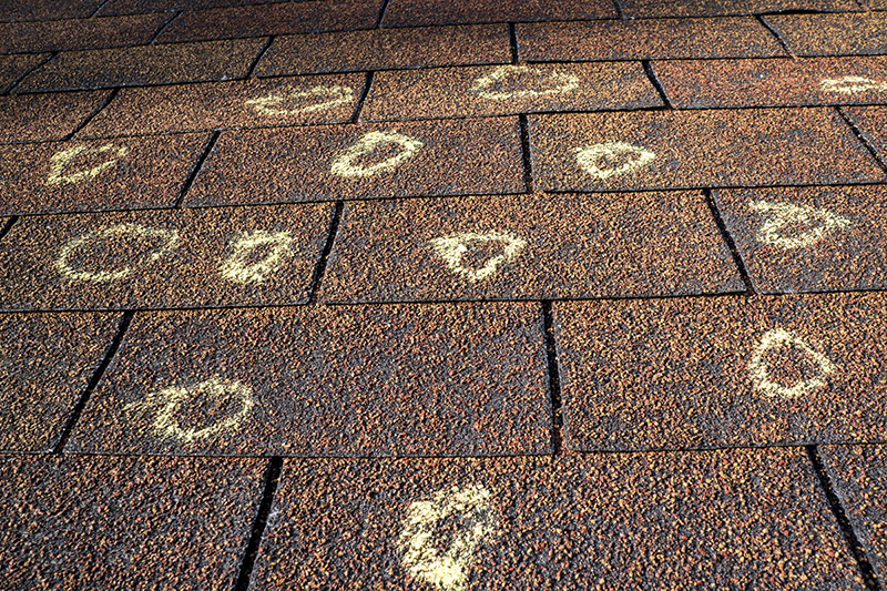 Close up roof inspection from storm damage